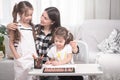 Mother with children sitting at the table and doing homework. The child learns at home. Home schooling Royalty Free Stock Photo