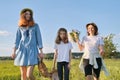 Mother with children two daughters walking along country road Royalty Free Stock Photo