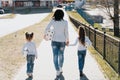 Mother with children walking with toilet paper from the supermarket during the pandemic Coronaviru. Covid-19 Panic