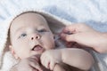 Mother cleaning ear with cotton swab to her baby boy Royalty Free Stock Photo