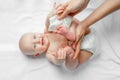 Mother cleaning up and wipes body and leg baby by wet tissue. Cleaning wipe, pure, clean. happy emotions of newborn baby Royalty Free Stock Photo