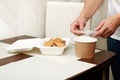 mother collects lunch for the child, cookies in the lunchbox, soup in the soup container. Royalty Free Stock Photo