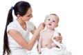 Mother combing baby Royalty Free Stock Photo