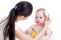 Mother combing baby`s hair after bathing Royalty Free Stock Photo