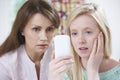 Mother Comforting Daughter Being Bullied By Text Message