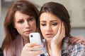 Mother Comforting Daughter Being Bullied By Text Message