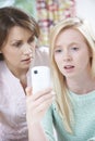 Mother Comforting Daughter Being Bullied By Text Message Royalty Free Stock Photo