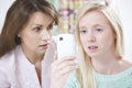 Mother Comforting Daughter Being Bullied By Text Message Royalty Free Stock Photo