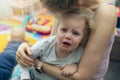 Mother comforting her crying little child Royalty Free Stock Photo