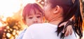 Mother comforting her crying little girl in the park. parenthood concept Royalty Free Stock Photo