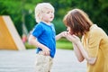 Mother comforting her son after he injured his hand Royalty Free Stock Photo