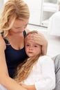Mother comforting her upset kid Royalty Free Stock Photo