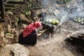 A mother cooks roasted coconut