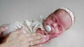 Mother cradles a newborn baby girl