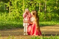 Mom asks her little daughter what happened during a walk in the park Royalty Free Stock Photo