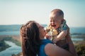 Mother and crying toddler son on nature background Royalty Free Stock Photo