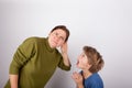 Mother cupping her hand behind ear can`t hear