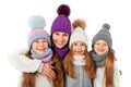 Mother and cute kids in winter warm hats and scarfs on white. Children winter clothes