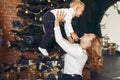 Mother with cute son at home near christmas tree Royalty Free Stock Photo