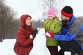 Mother and dad with daughter sculpt snowman