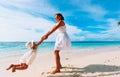 Mother and daugher playing on tropical beach Royalty Free Stock Photo