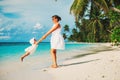 Mother and daugher playing on tropical beach Royalty Free Stock Photo