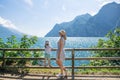 Mother and daughter admire the scenery of the Alps and Lake Garda at Italy Royalty Free Stock Photo