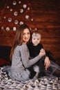 Mother and daughter on background of New Year`s decorations. New Year and Christmas. selective focus