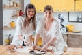 Mother daughter baking making biscuits cookies pan Royalty Free Stock Photo