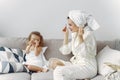 Mother with daughter in bathrobe and towels Royalty Free Stock Photo