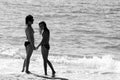 Mother and daughter on the beach. black and white. photo.