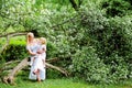 Mother and daughter in blooming garden