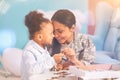 Mother and daughter bonding while doing a puzzle Royalty Free Stock Photo