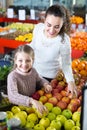 Mother and daughter buying apples Royalty Free Stock Photo