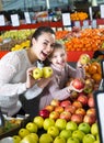 Mother and daughter buying apples Royalty Free Stock Photo