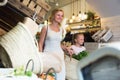 Mother with daughter buying chilled foods in supermarket Royalty Free Stock Photo