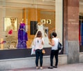 Mother and daughter buying wedding dress at fashion store boutique