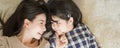 Mother and daughter child girl spending time together in the bedroom Look at each other and smiling .Happy Asian family. Royalty Free Stock Photo