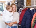 Mother and daughter choosing baby clothes Royalty Free Stock Photo