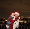 Mother and daughter in Christmas hats showing thumbs up, Italy Royalty Free Stock Photo