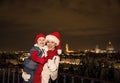 Mother and daughter in Christmas hats showing thumbs up, Italy Royalty Free Stock Photo