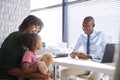 Mother And Daughter In Consultation With Doctor In Office Royalty Free Stock Photo