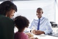 Mother And Daughter In Consultation With Doctor In Office Royalty Free Stock Photo