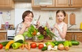 Mother and daughter cook and taste soup from vegetables. Home kitchen interior. Parent and child, woman and girl. Healthy food con Royalty Free Stock Photo