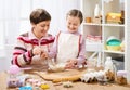 Mother and daughter cooking and having fun, home kitchen interior, healthy food concept Royalty Free Stock Photo