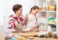 Mother and daughter cooking and having fun, home kitchen interior, healthy food concept Royalty Free Stock Photo