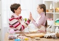 Mother and daughter cooking and having fun, home kitchen interior, healthy food concept Royalty Free Stock Photo