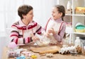 Mother and daughter cooking and having fun, home kitchen interior, healthy food concept Royalty Free Stock Photo