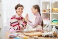 Mother and daughter cooking and having fun, home kitchen interior, healthy food concept Royalty Free Stock Photo