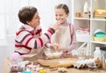 Mother and daughter cooking and having fun, home kitchen interior, healthy food concept Royalty Free Stock Photo